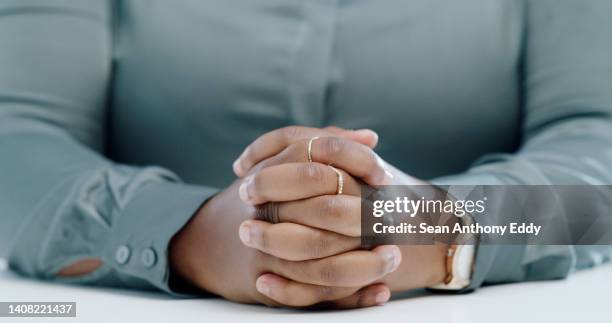 closeup of attentive business woman's folded hands, patient, ready to discuss strategy idea in office. professional manager and boss patiently waiting, listening to solution. anticipating interview hr - folded hands stock pictures, royalty-free photos & images