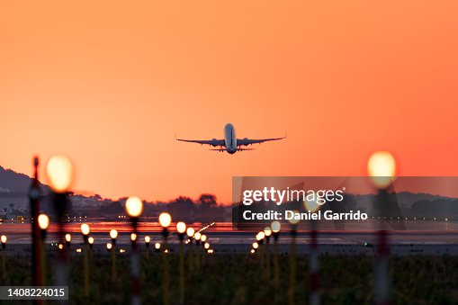 Airplane taking off at sunrise, travel and tourism Airplane taking off at sunrise, travel and tourism