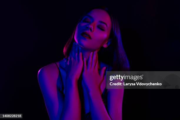 affectionate lady close her eyes dancing alone enjoy her young body perfect make up flawless skin on dark background - goosebumps up close stock pictures, royalty-free photos & images