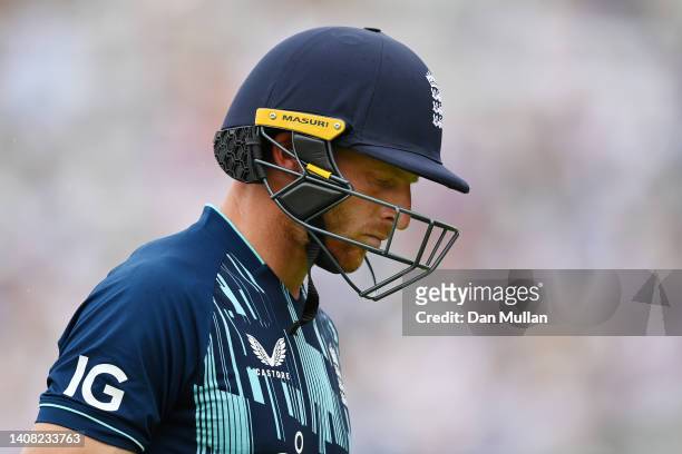 Jos Buttler of England leaves the field dejected after being caught bySuryakumar Yadav of India during the 1st Royal London Series One Day...
