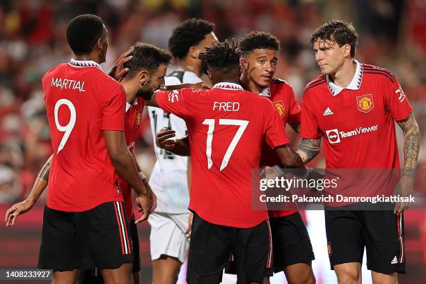 Jadon Sancho of Manchester United celebrates with his teammates after scoring their first goal against Liverpool during the first half of a preseason...