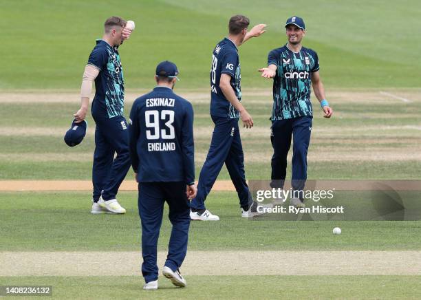 David Payne of England Lions celebrates with teammates after bowling out Khaya Zondo of South Africa during the tour match between England Lions and...