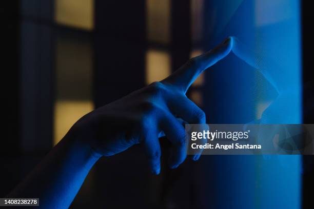 close up view of woman hand using interactive touchscreen display of electronic kiosk - royal blue stock pictures, royalty-free photos & images