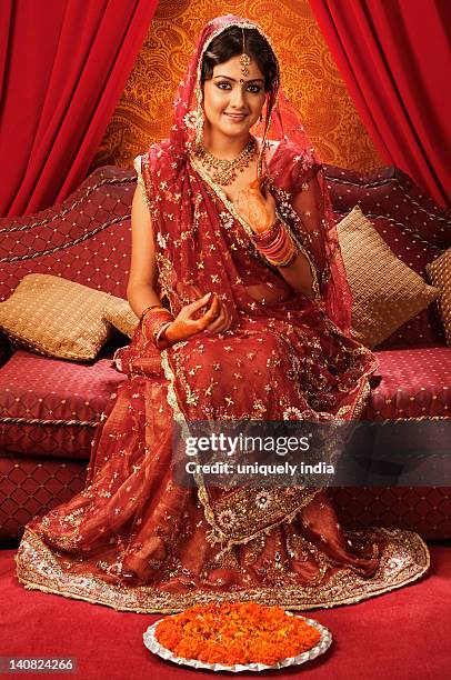 portrait of a bride in a traditional wedding dress - indian bride stock-fotos und bilder
