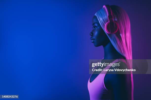 youth generation millennial girl with straight white hairdo wig listen new hit song use mew technology headset look side - black dj stock pictures, royalty-free photos & images