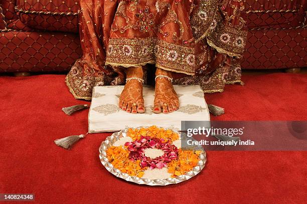 bride's feet with henna decoration on a cushion with pooja thali - indian female feet stock pictures, royalty-free photos & images