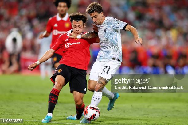 Facundo Pellistri of Manchester United competes for the ball against Konstantinos Tsimikas of Liverpool during the second half of a preseason...
