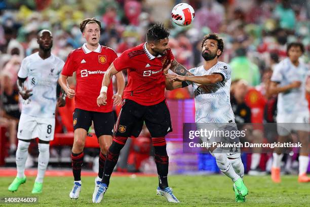 Alex Telles of Manchester United competes for a header against Mohamed Salah of Liverpool during the second half of a preseason friendly match at...