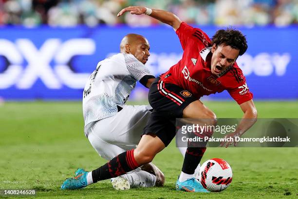 Fabinho of Liverpool competes for the ball against Facundo Pellistri of Manchester United during the second half of a preseason friendly match at...