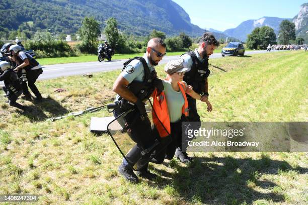 The police arrest protesters in defending "Mont Blanc environment" that block the route during the 109th Tour de France 2022, Stage 10 a 148,1km...