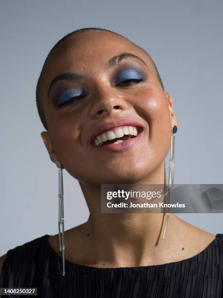 portrait happy, beautiful young woman with blue eyeshadow - earring closeup stock pictures, royalty-free photos & images