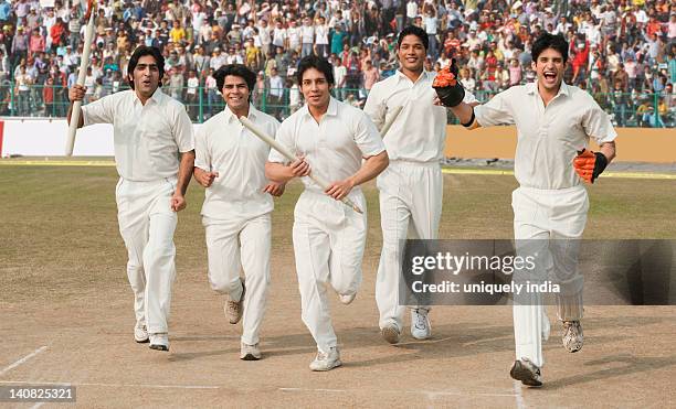 cricket players celebrating their success - cricket spectator stock pictures, royalty-free photos & images