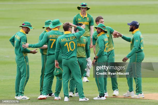 Aiden Markram of South Africa celebrates with teammates after catching out Sam Hain of England Lions during the tour match between England Lions and...