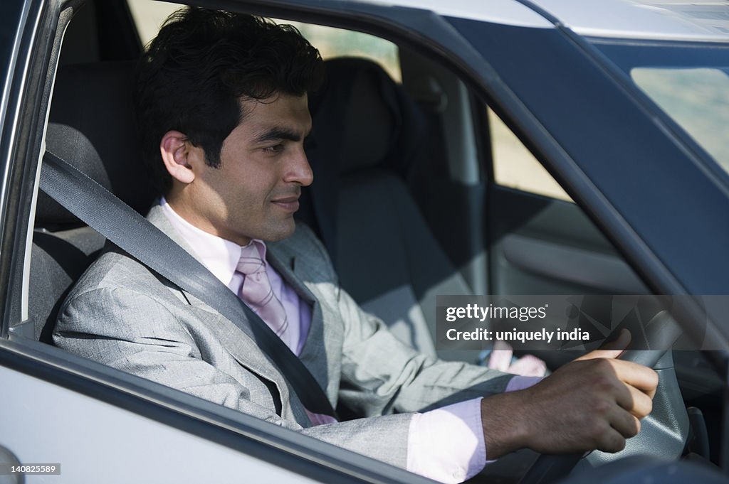 Businessman driving a car