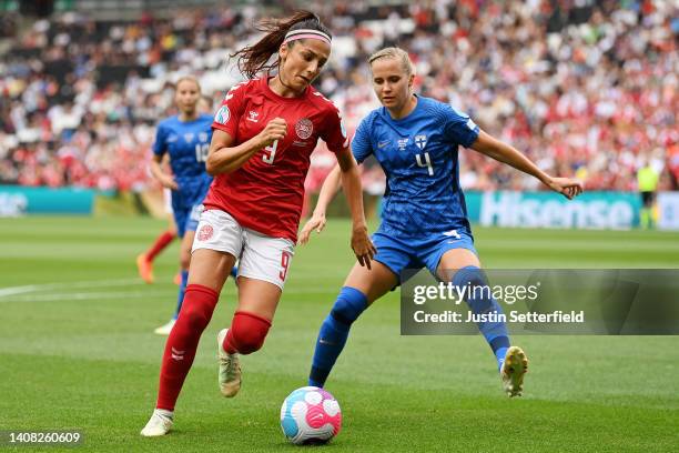 Nadia Nadim of Denmark battles for possession with Ria Oling of Finland during the UEFA Women's Euro 2022 group B match between Denmark and Finland...