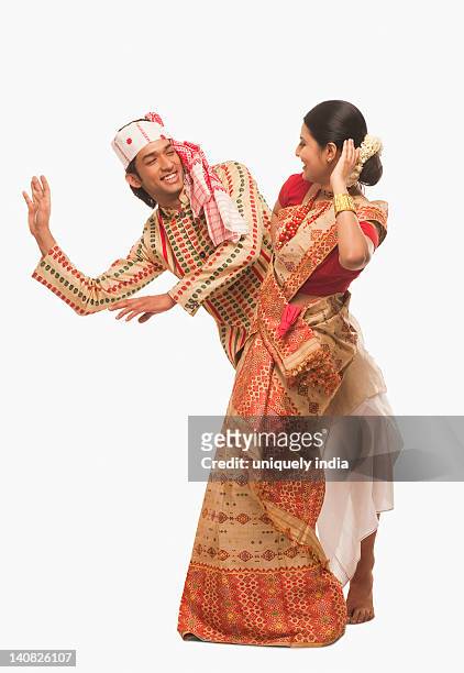 couple dancing on bihu festival - bihu stock pictures, royalty-free photos & images