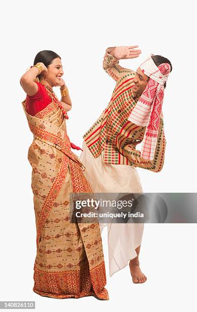 couple dancing on bihu festival - bihu stock pictures, royalty-free photos & images