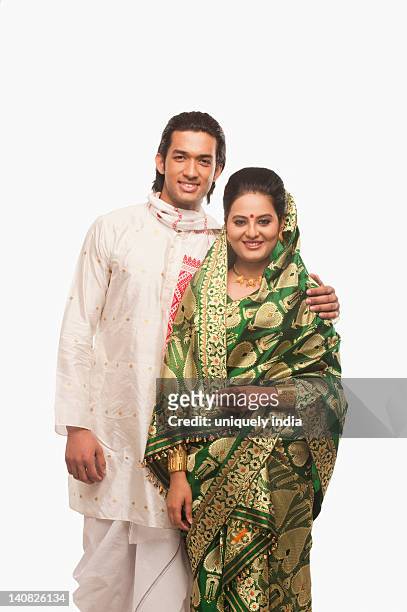 portrait of a couple smiling in traditional clothing on bihu festival - bihu stock pictures, royalty-free photos & images