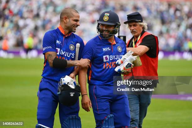 Shikhar Dhawan of India and Rohit Sharma of India leave the field after securing victory during the 1st Royal London Series One Day International...