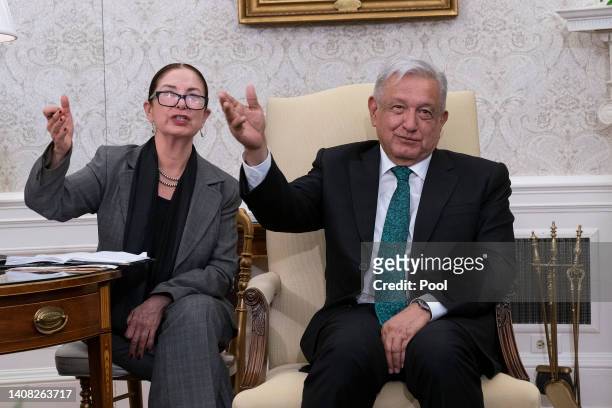 Mexican President Andres Manuel Lopez Obrador gestures with his translator during a meeting with U.S. President Joe Biden in the Oval Office at the...