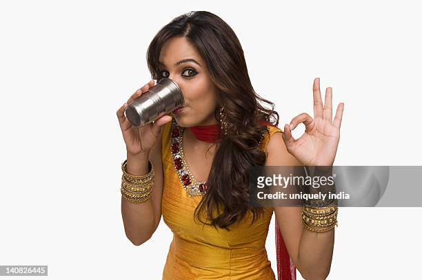 woman drinking lassi the traditional indian beverage - lassi stock pictures, royalty-free photos & images