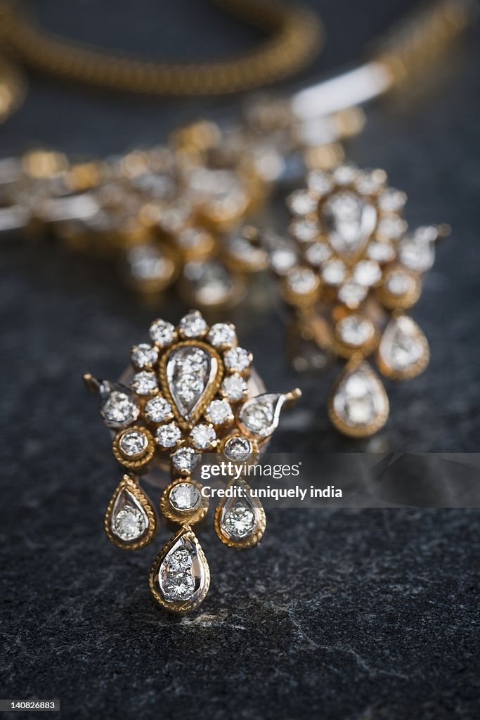 Close-up of a necklace with a pair of earrings