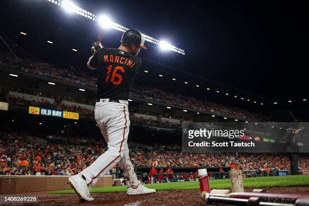 Trey Mancini of the Baltimore Orioles warms up against the Los Angeles Angels during the eighth inning at Oriole Park at Camden Yards on July 8, 2022...