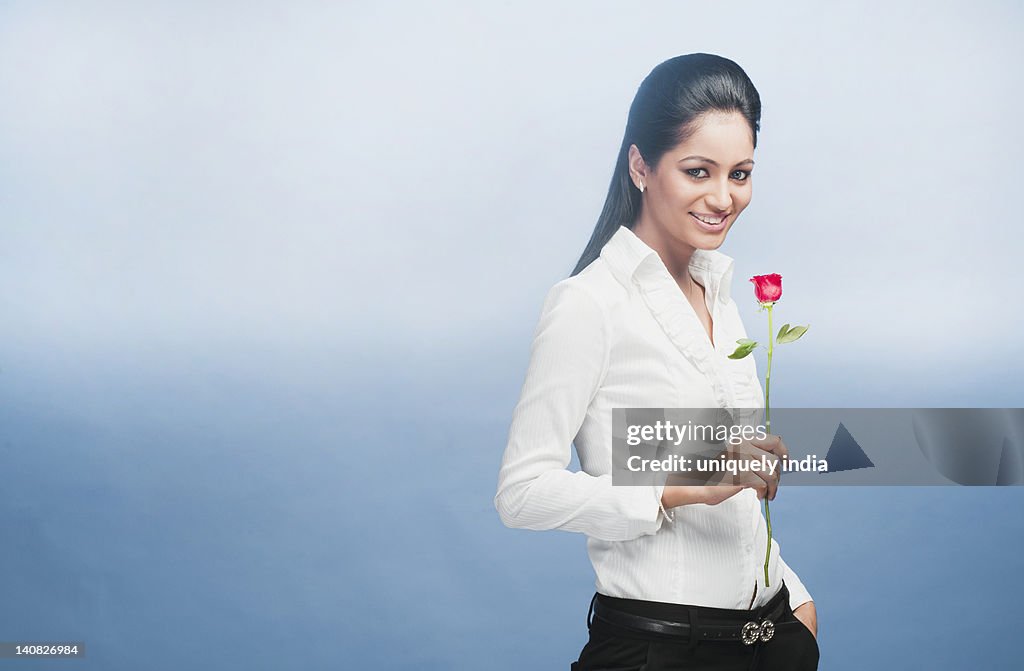 Portrait of a businesswoman holding a Rose