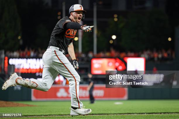 Trey Mancini of the Baltimore Orioles celebrates after hitting a walk-off RBI single against the Los Angeles Angels during the ninth inning at Oriole...