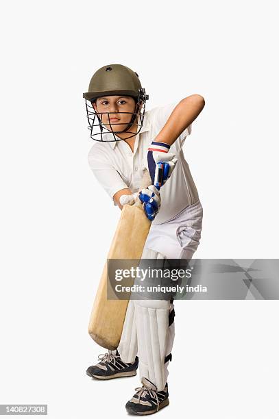 boy playing cricket - cricket player white background stock-fotos und bilder