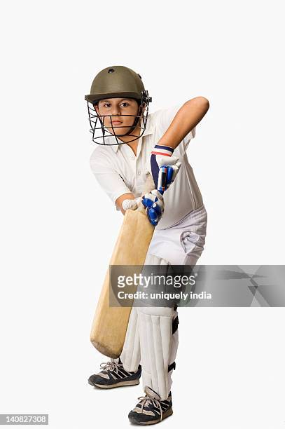 boy playing cricket - cricket player stock pictures, royalty-free photos & images