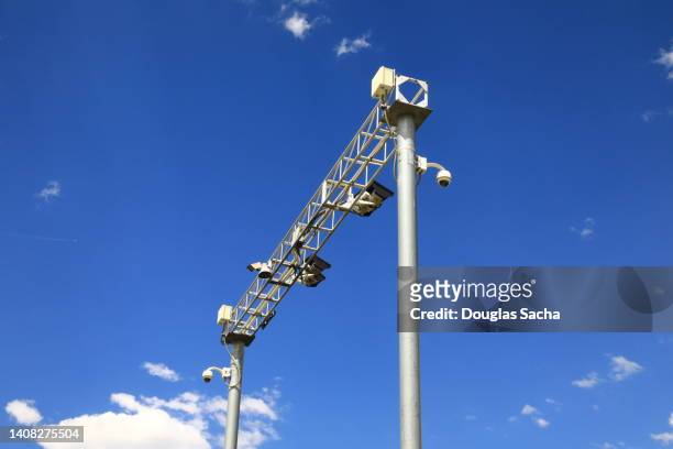 signal mast with railroad signal lights - pedestrian light stock pictures, royalty-free photos & images