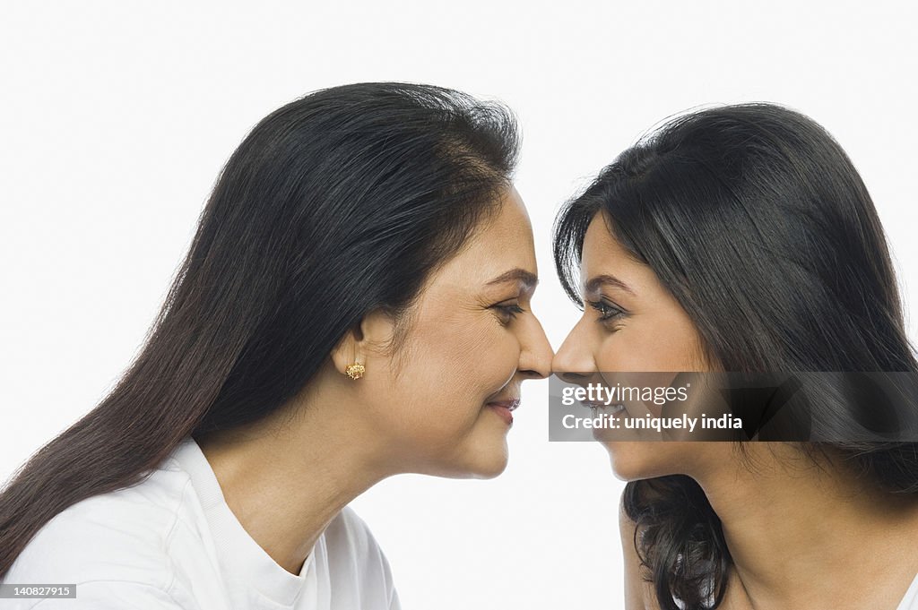 Close-up of a woman rubbing noses with her mother