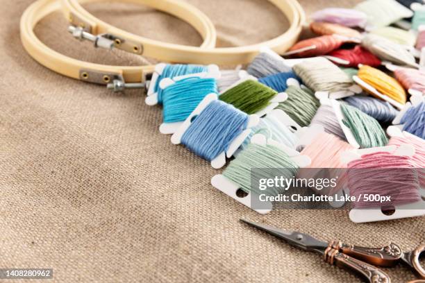 embroidery floss with hoops and scissors on linen - wool tread stock pictures, royalty-free photos & images
