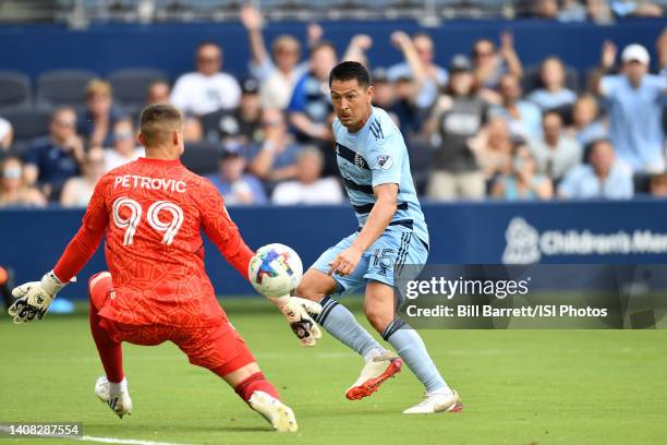 Roger Espinoza of Sporting Kansas City shoots on goal during a game between New England Revolution and Sporting Kansas City at Children's Mercy Park...