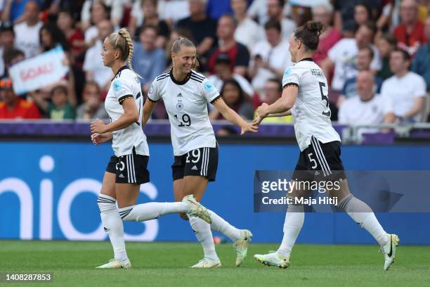 Klara Buehl of Germany celebrates their team's first goal with teammates Giulia Gwinn and Marina Hegering during the UEFA Women's Euro England 2022...