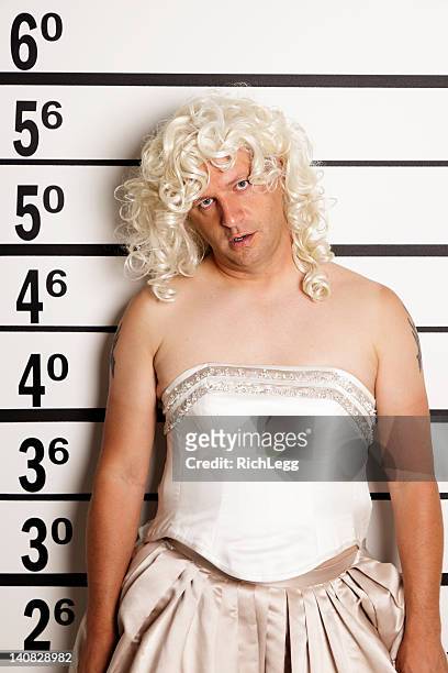 mugshot of a man in drag - blond wig stock pictures, royalty-free photos & images