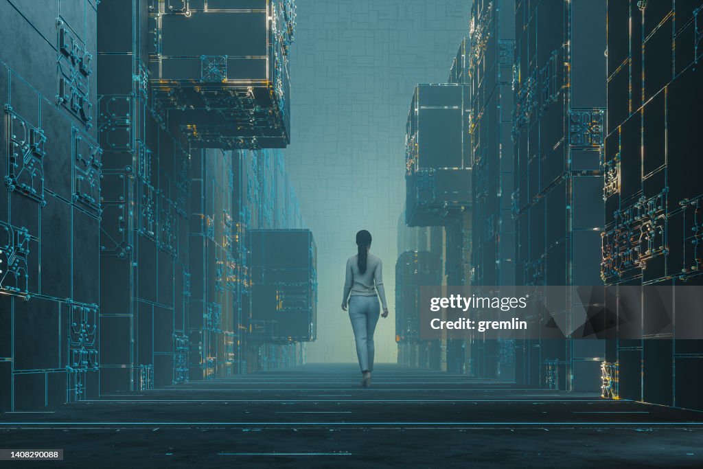 Woman walking in dark futuristic street