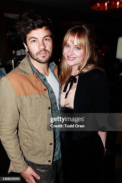 Jordy Masterson and Dakota Johnson pose at the People: Spring Collection on March 6, 2012 in West Hollywood, California.