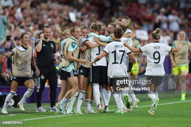 Alexandra Popp of Germany celebrates their team's second goal with teammates during the UEFA Women's Euro England 2022 group B match between Germany...