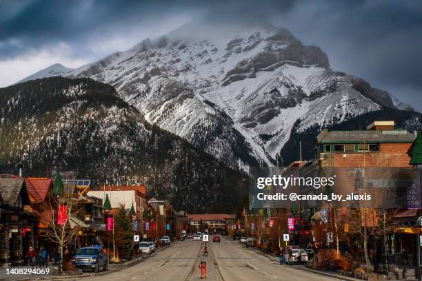 moody, stormy town of banff - banff springs hotel stockfoto's en -beelden