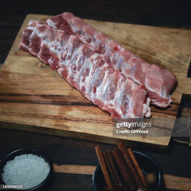 bbq pork spareribs on barbecue grill - barbeque sauce stock pictures, royalty-free photos & images