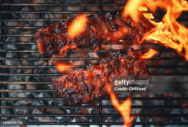 bbq pork spareribs on barbecue grill - barbeque sauce stock pictures, royalty-free photos & images