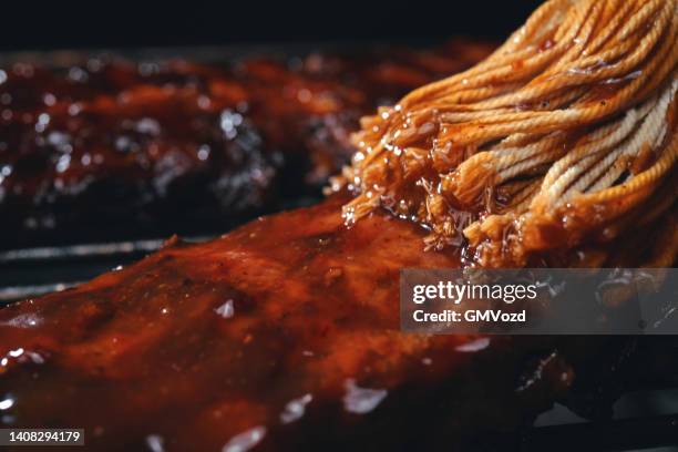 bbq pork spareribs on barbecue grill - barbeque sauce stock pictures, royalty-free photos & images