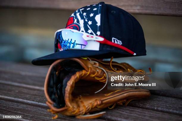 Amarillo Sod Poodles players are shown in the reflection of a pair of sunglasses during the game against the Northwest Arkansas Naturals at HODGETOWN...