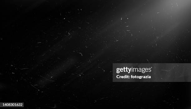 scratched black background - deeltje stockfoto's en -beelden