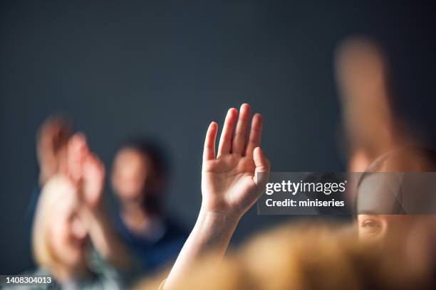 close up of a raised hand - answering stock pictures, royalty-free photos & images