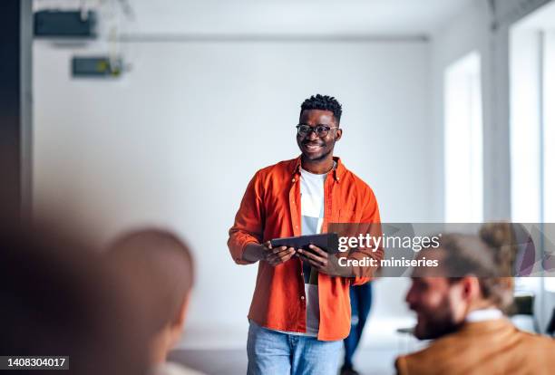 cheerful male presenter interacting with the audience - portrait of teacher and student bildbanksfoton och bilder