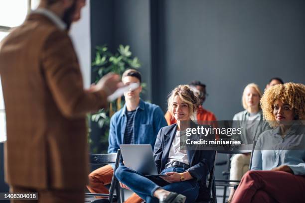 group of cheerful people on a seminar - kurs bildbanksfoton och bilder