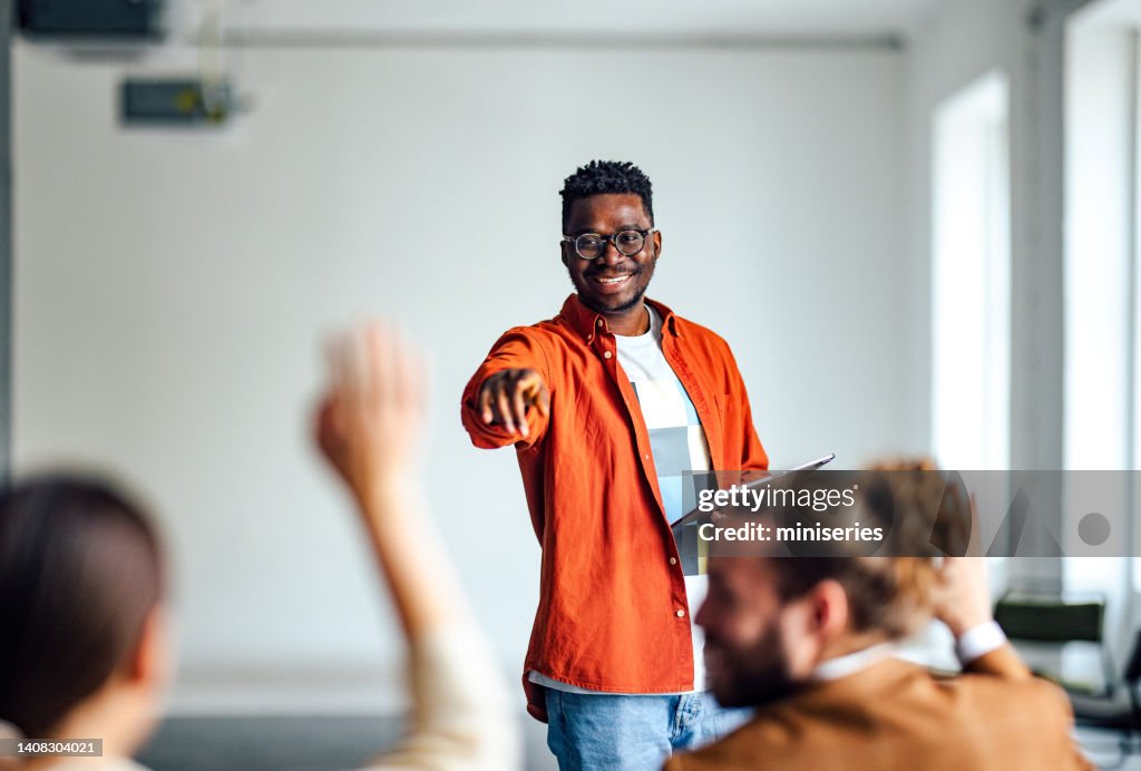 Cheerful Male Presenter Interacting With the Audience